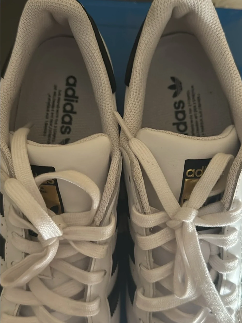adidas Superstar white and black sneakers